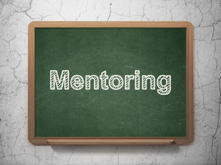 Education concept: Mentoring on chalkboard background