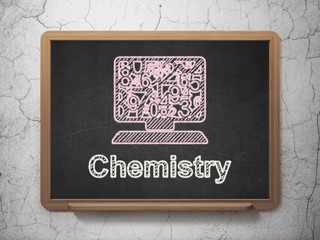 Education concept: Computer Pc and Chemistry on chalkboard