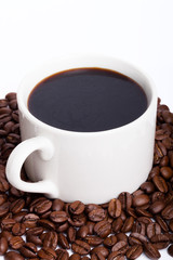 Coffee cup and beans on a white background