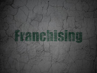 Finance concept: Franchising on grunge wall background