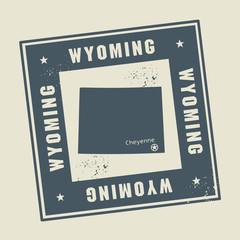 Grunge rubber stamp with name and map of Wyoming, USA