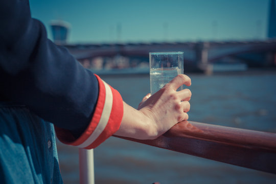 Relaxing with drink of water on a boat