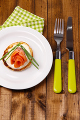 Pancake with salmon and mayo, green onion,