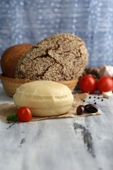 Tasty Italian cheese on wooden table