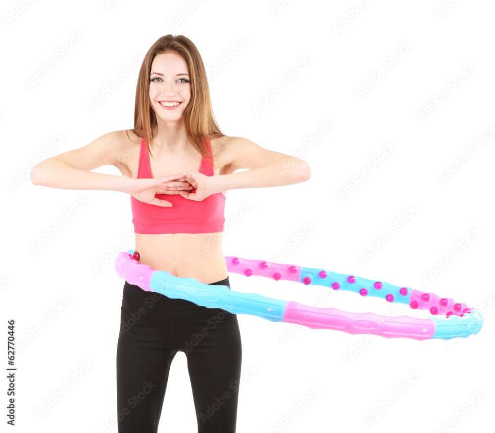 Wall mural Woman doing exercises with hula hoop isolated on white