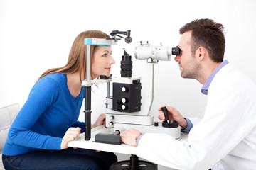 Optometrist performing visual field test