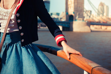 Holding on to the rail onboard a ship