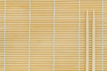 Sticks on wooden background.