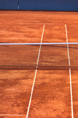 Empty Clay Tennis Court and Net © dvoevnore