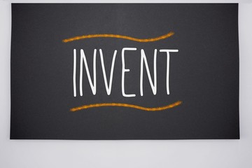 Invent written on big blackboard