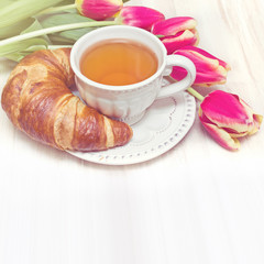 Vintage style breakfast tea and flowers