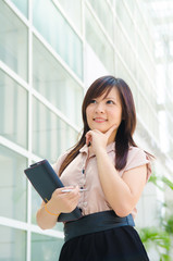 young asian business woman with office background