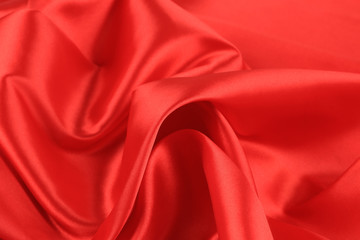 Close up of red silk fabric background.