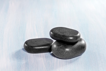 Zen stones on a wooden background