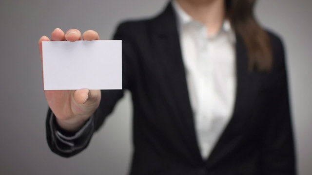 businesswoman showing a business card