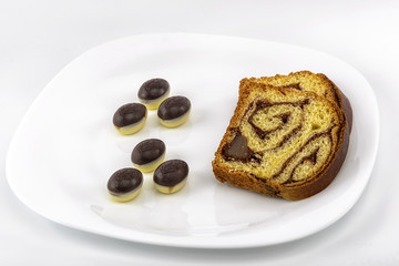 cake, chocolate Easter eggs on a plate