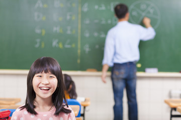 happy student in class with teacher