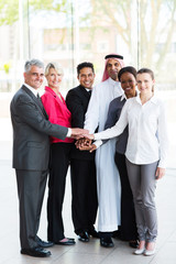 business people putting their hands together