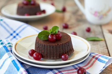 Chocolate fondant lava cake with cranberry and mint