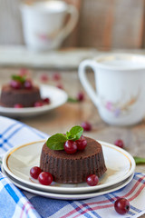 Chocolate fondant lava cake with cranberry and mint