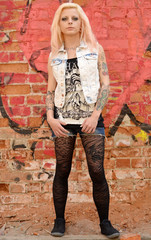 tattoo Girl front of a Wall