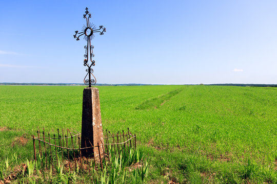 Cross in a grassy field