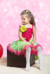 Portrait of a cute little girl looking away, abstract background © rodjulian