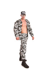 Sexy naked military man posing on a white background