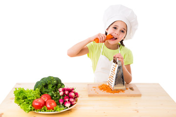 Girl with grater eating the carrots