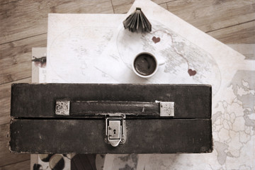 Artwork  in vintage  style, cup of coffee and old suitcase
