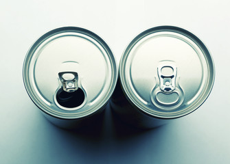 Two aluminum cans isolated on gray