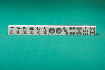 Smooth table surface with a mahjong on it