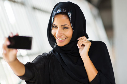 arabian woman taking self portrait
