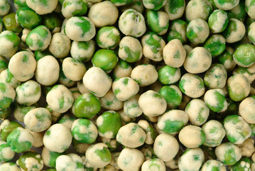nuts. green pea on the background