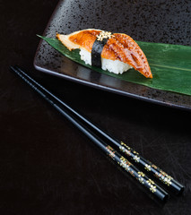 japanese cuisine. sushi unagi on the background