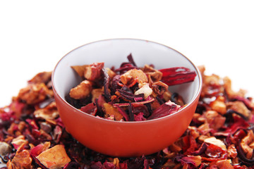 Dry green tea in bowl isolated on white