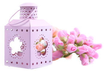 Decorative metallic lantern and artificial flowers, isolated