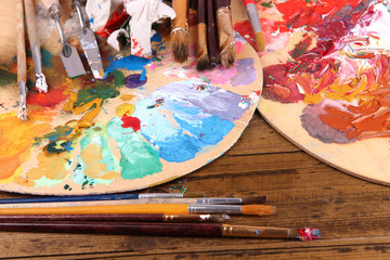 Artistic equipment: paint, brushes and art palette