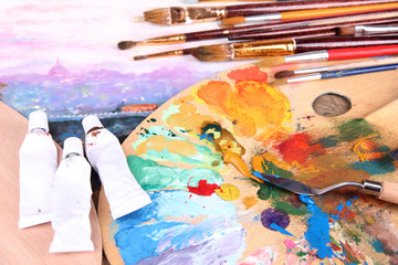 Artistic equipment: paint, brushes and art palette