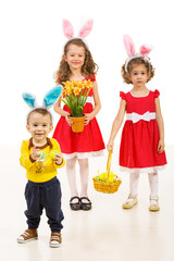 Happy three brothers with Easter eggs