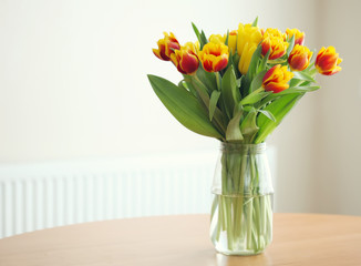 vase of tulips on table