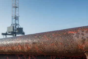 Closeup of a rusty tube with water droplets