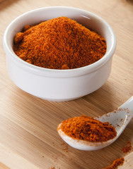 paprika spice on wooden background