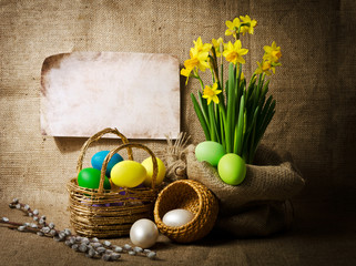 Colorful easter eggs in brown basket