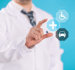 Fototapeta na wymiar Doctor hand showing medicine symbols on digital screen