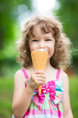 Happy child eating ice cream