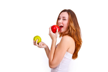 Attractive girl eating apples on a white background