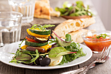 Grilled vegetables stacked on plate