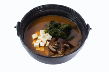 soup with tofu and seaweed on a vintage background