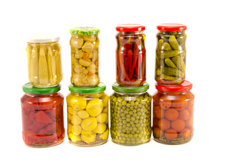 collection canned vegetables in glass jars on white